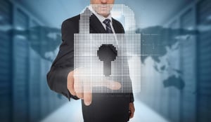 Businessman selecting a digital padlock with a world map on the background